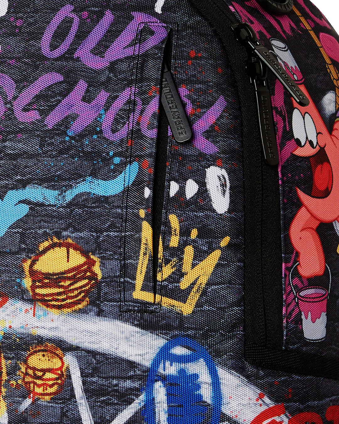 sprayground backpack showcasing various 90s nicktoons characters and graffiti designs