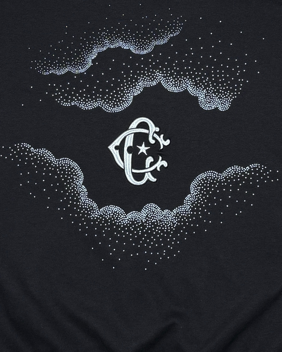 Black t-shirt with white rhinestone design of a fish and starfish on clouds.