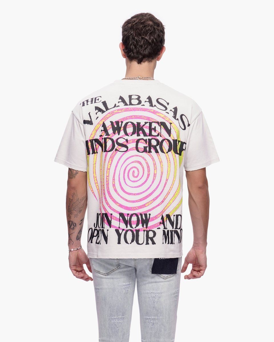 Person wearing a white t-shirt with colorful text and design on the back, on a white background