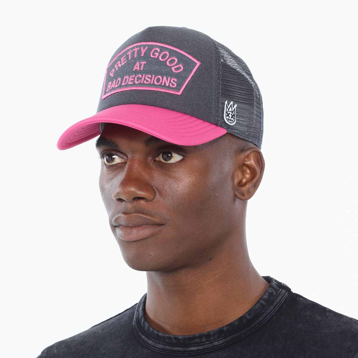 Cult of individuality Good At Bad Decisions Trucker Hat in charcoal and pink