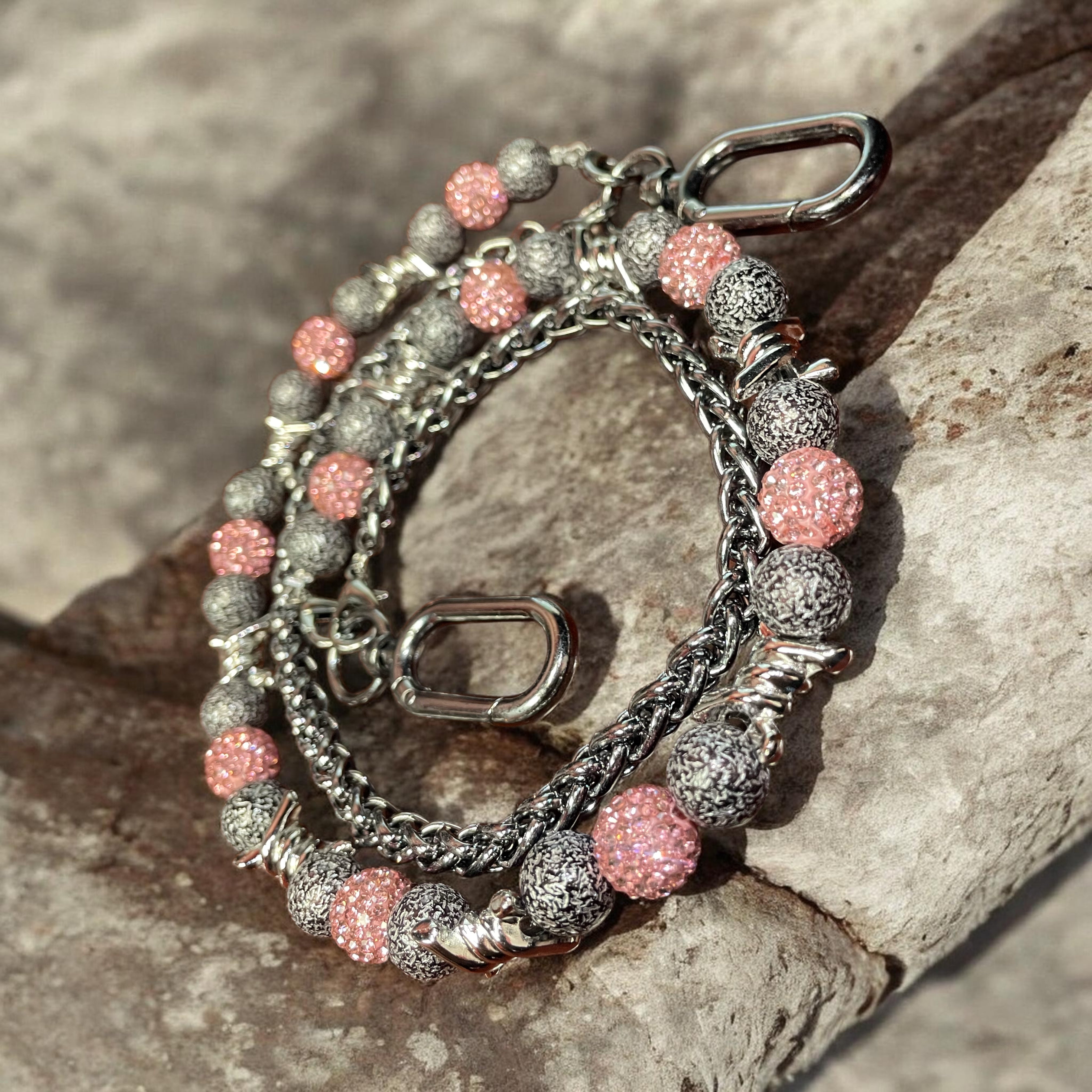 WALLET CHAIN with pink and silver beads on a stone surface