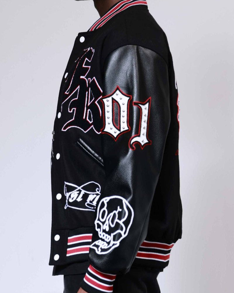 Black varsity jacket with white and red designs on a plain background