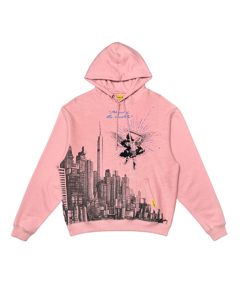 Pink hoodie with cityscape design on a white background