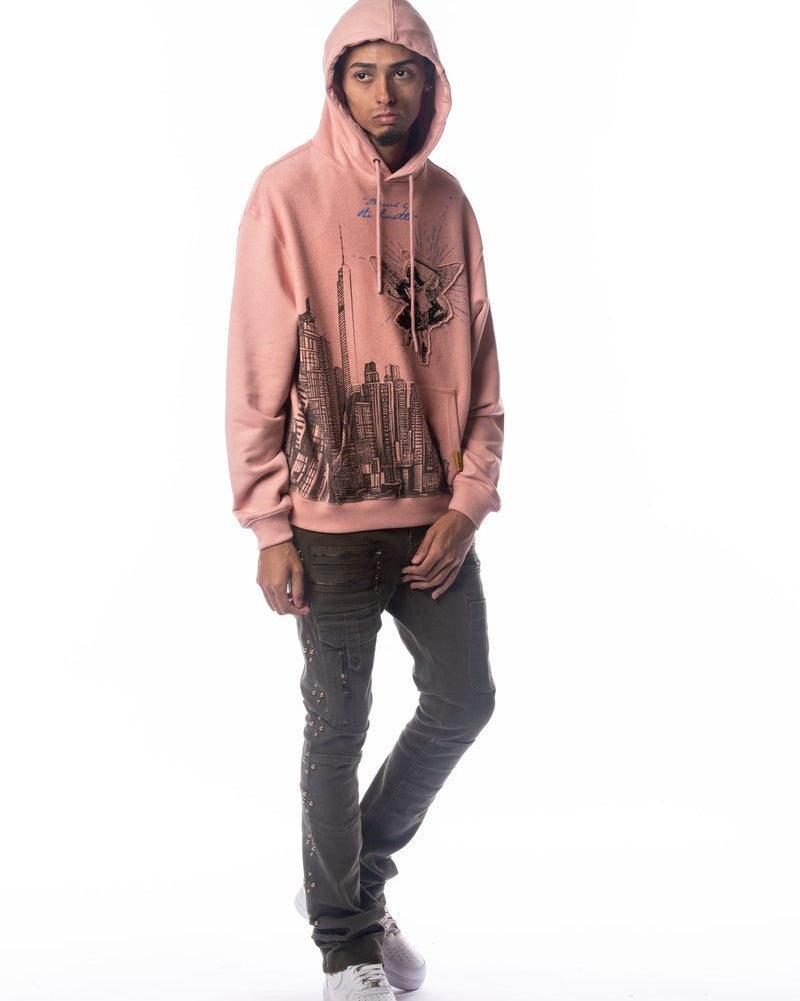 Person wearing a pink hoodie with a graphic design on a white background