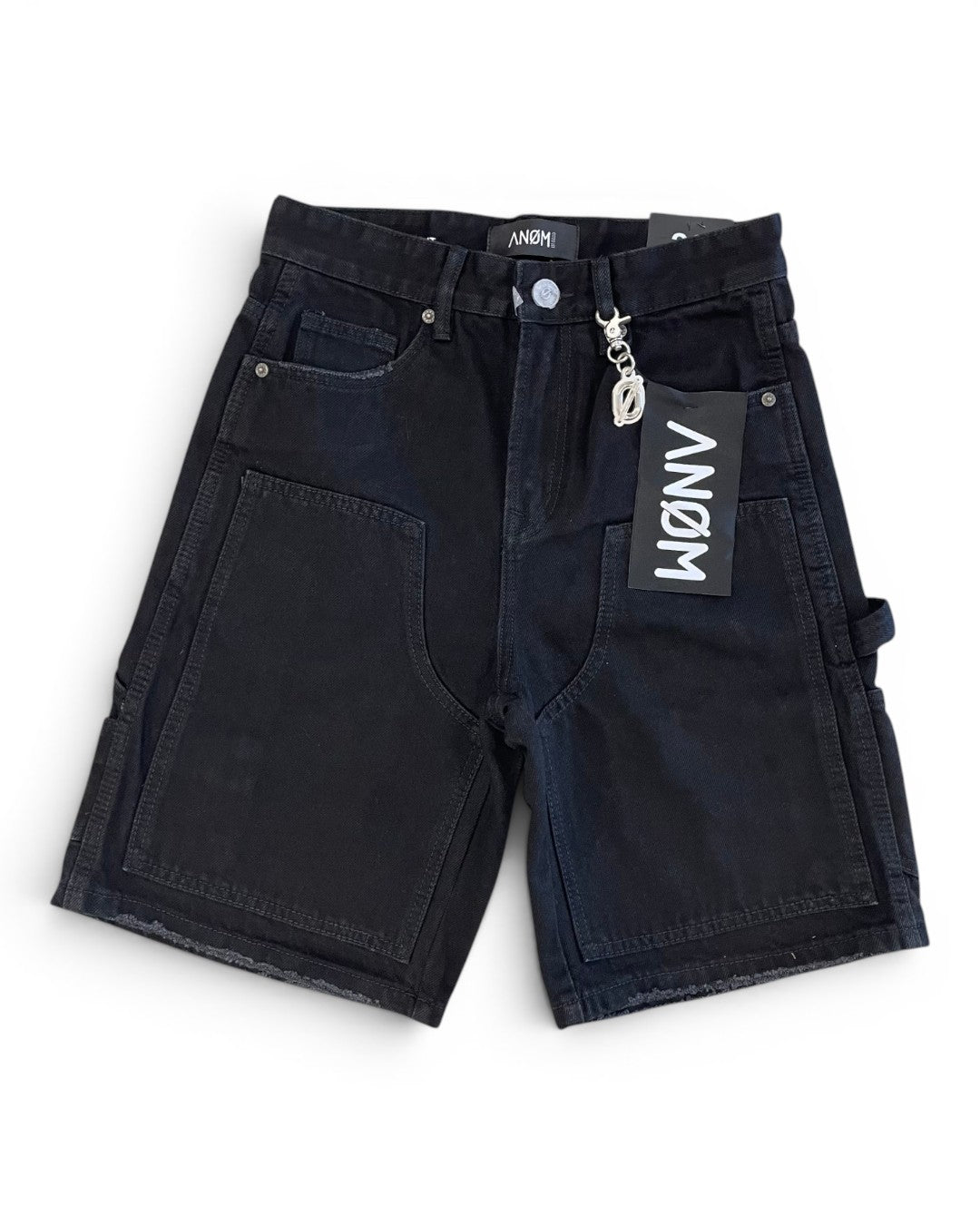 Black shorts with a brand tag on a white background