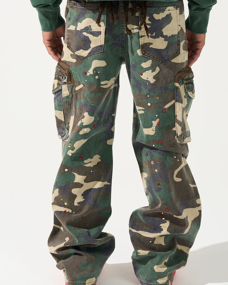 Camouflage pants worn by a person on a white background