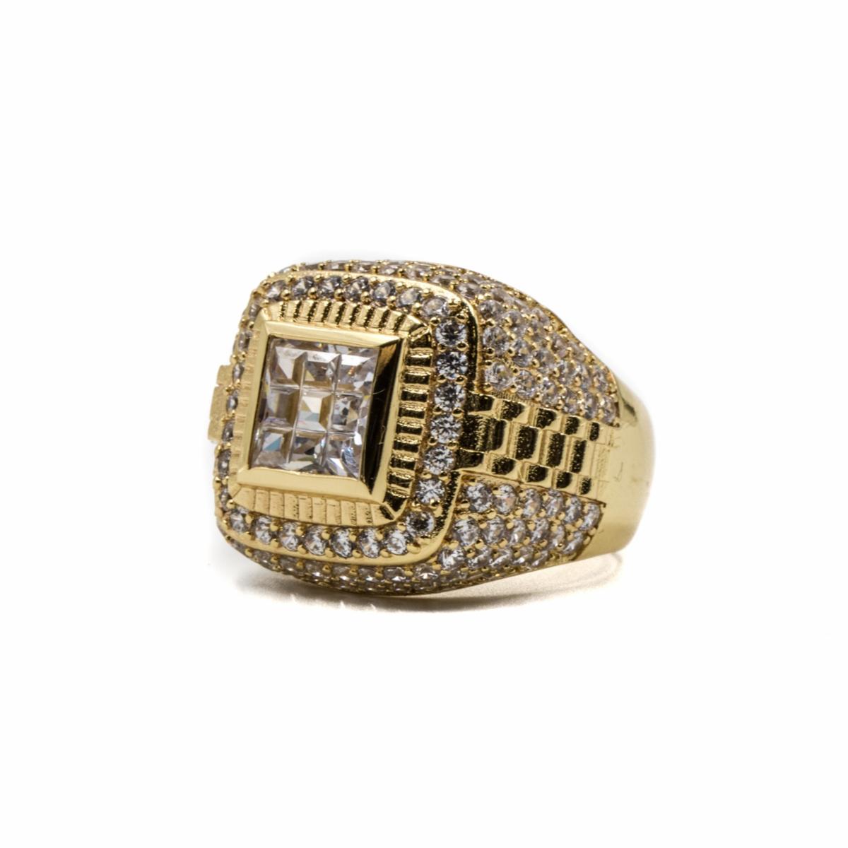 close up of the gold championship ring encrusted with diamonds on a BLANK WHITE BACKGROUND