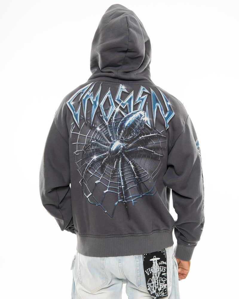 Gray hoodie with spider web design on the back, worn by a person, on a white background