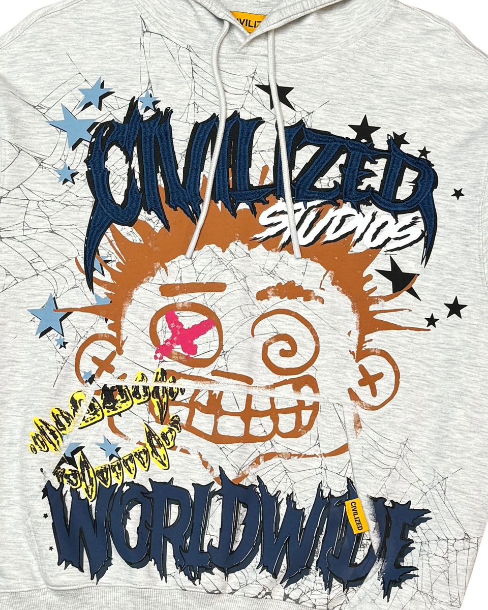 Gray hoodie with colorful graphic design featuring text and a skull-like face.