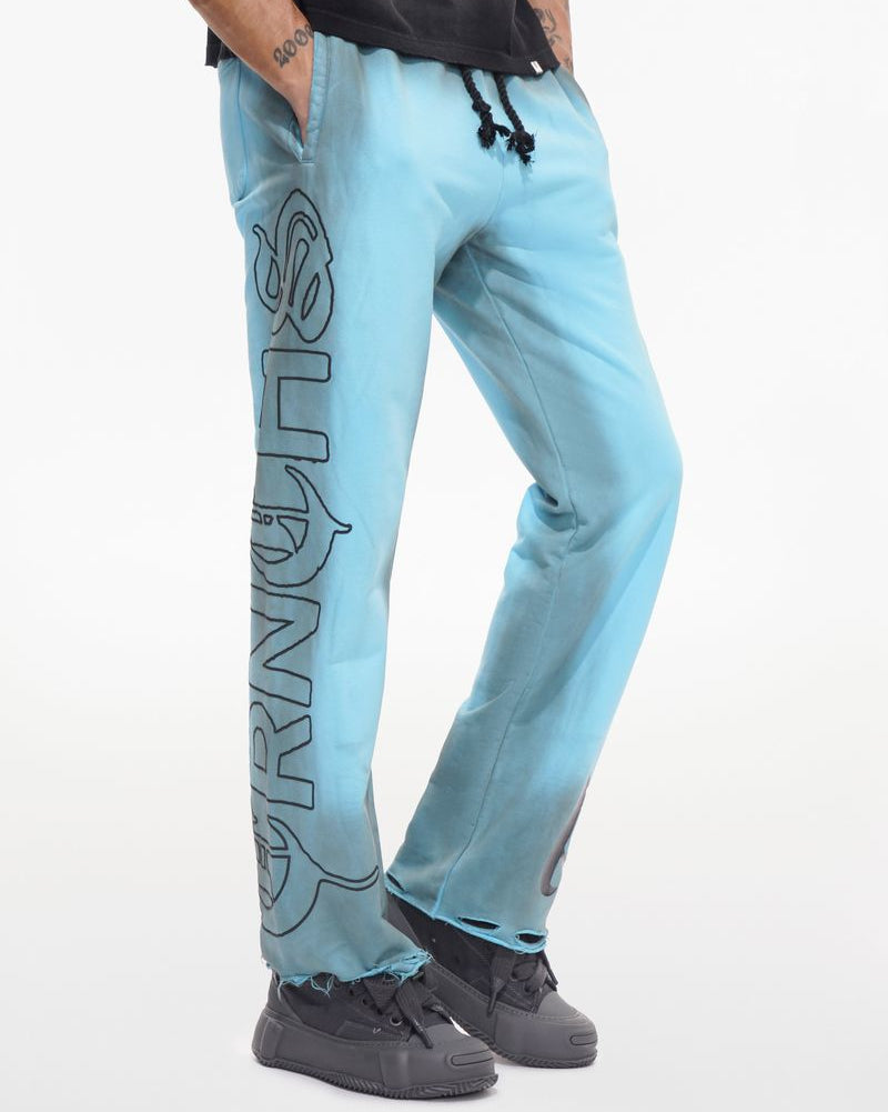 Light blue jogger pants with a logo on a white background
