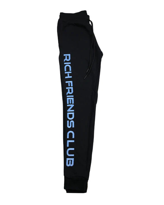 Black sweatpants with 'Rich Friends Club' text on a white background
