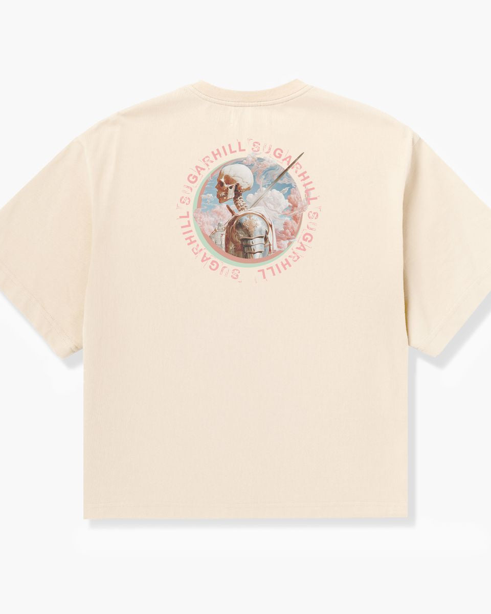Beige t-shirt with a graphic design on the back against a white background