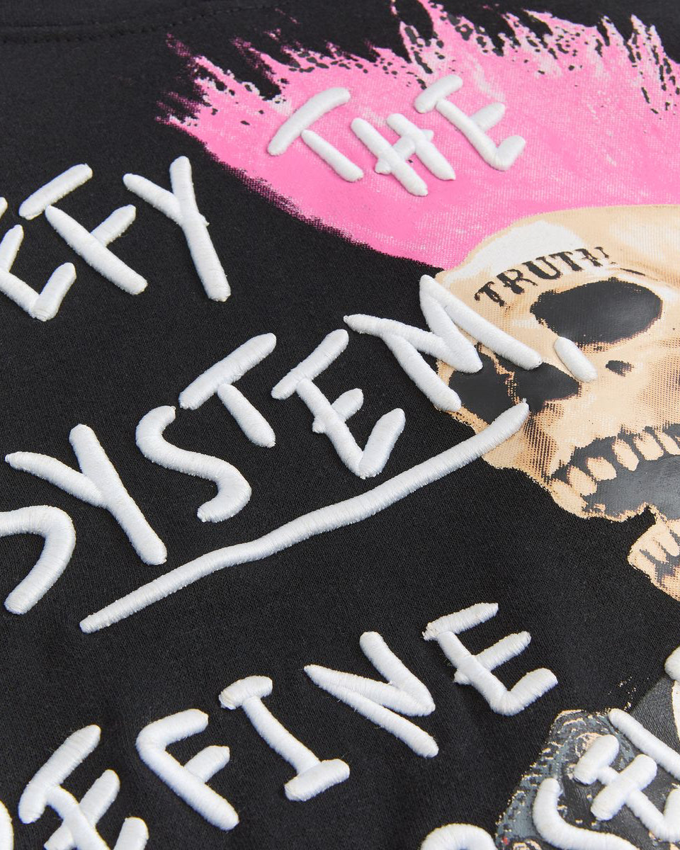 Black shirt with white text and a pink mohawk graphic, featuring a skull design.
