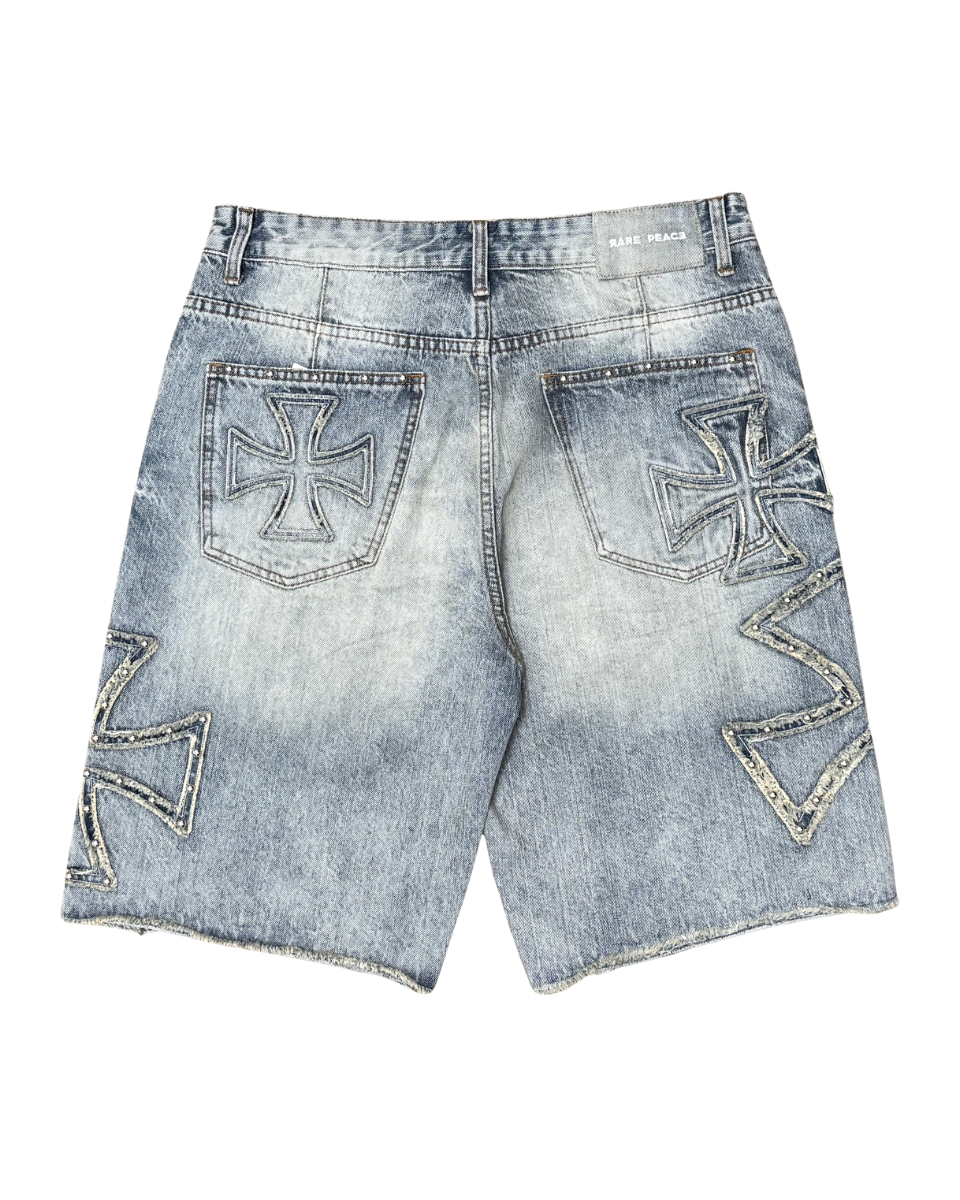 Denim shorts with embroidered designs on a white background