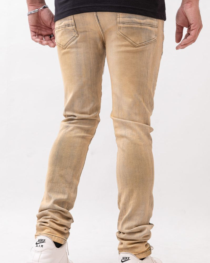 Beige jeans worn by a person on a white background