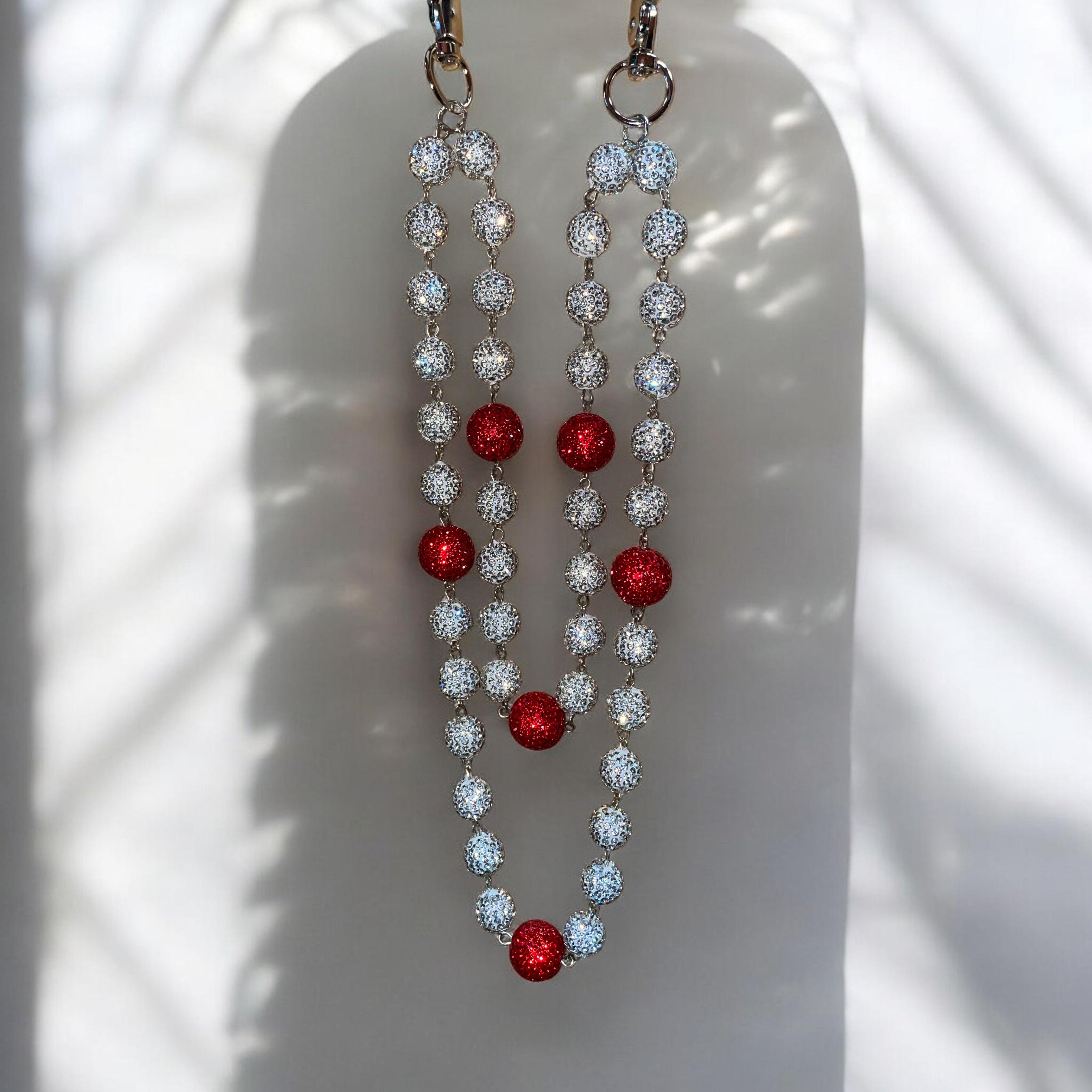 WALLET CHAIN with red and WHITE gemstones on a white background