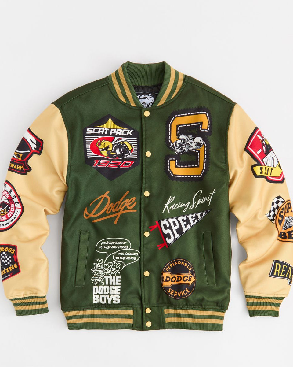 Green and beige varsity jacket with various patches on a white background