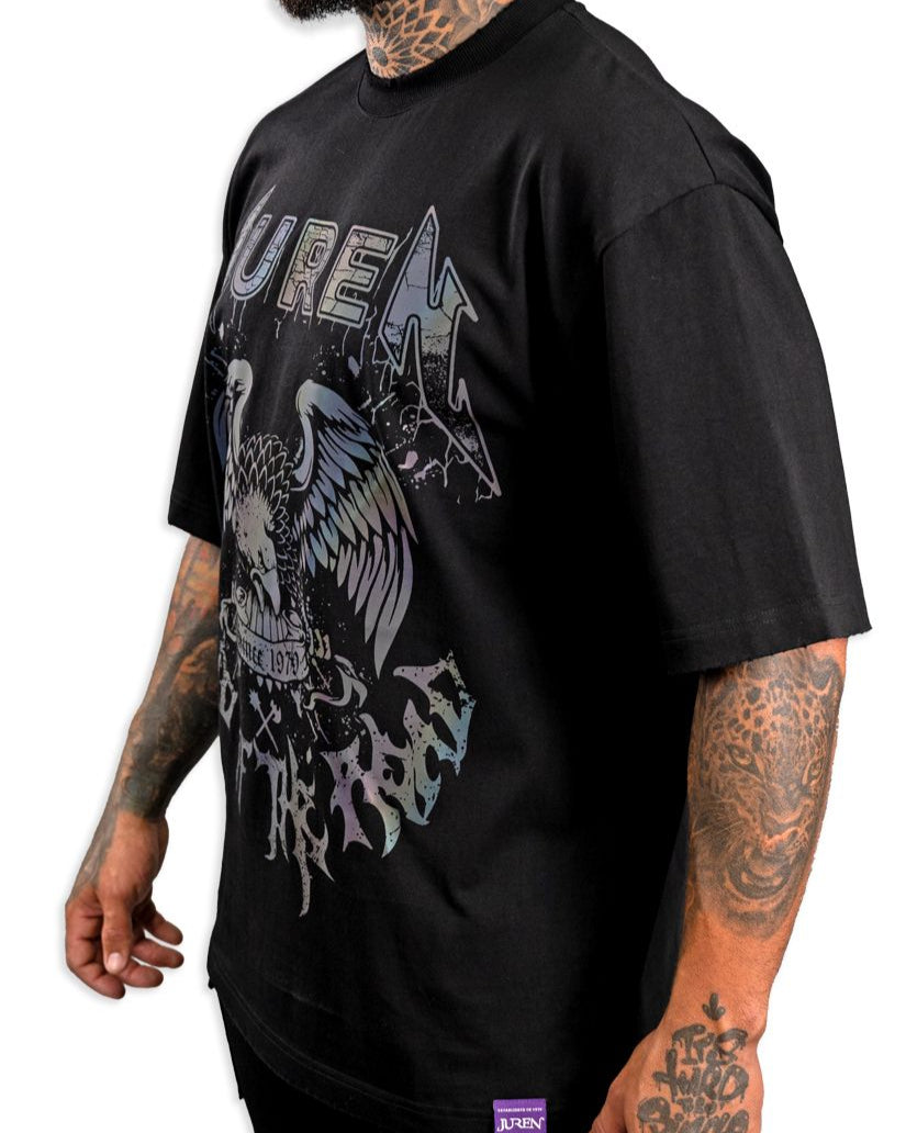 Person wearing a black t-shirt with a graphic design on a white background