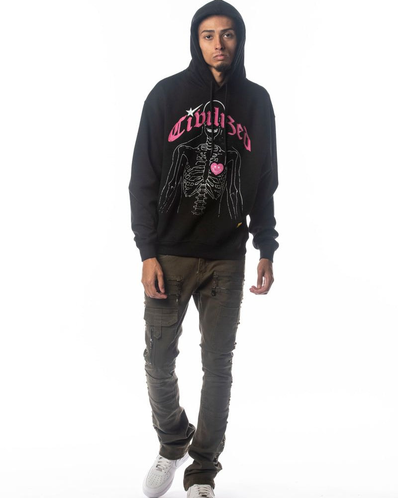 Person wearing a black hoodie with pink text and graphics on a white background