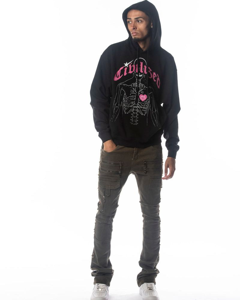 Person wearing a black hoodie with pink text and graphics on a white background