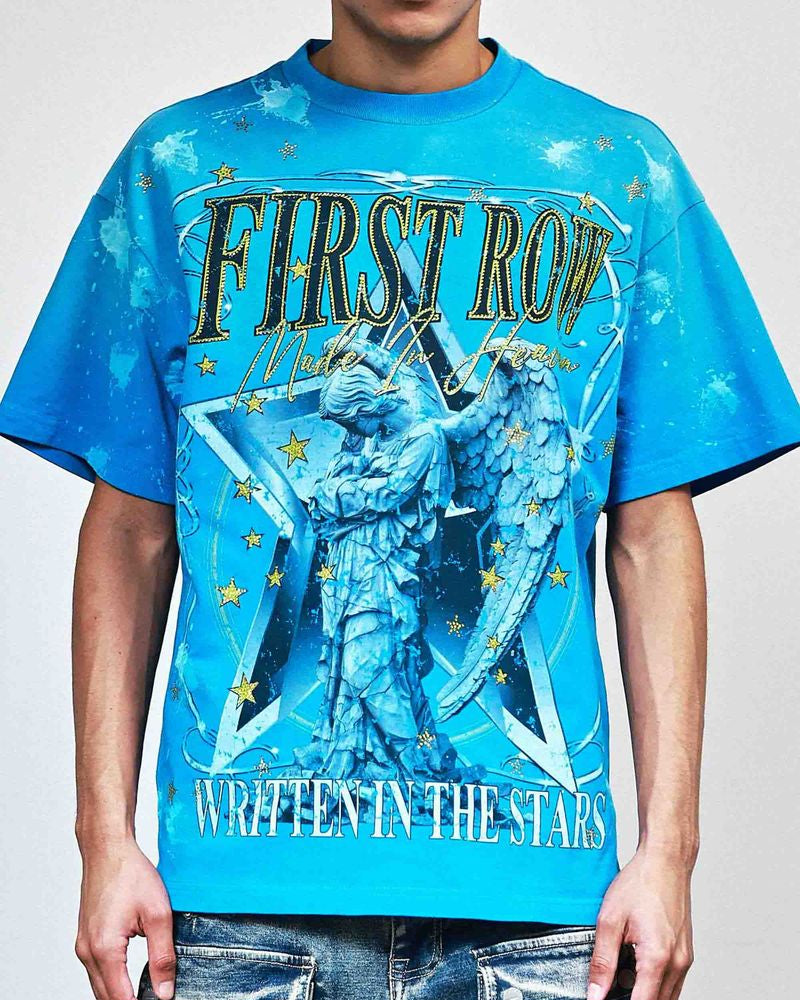 Person wearing a blue t-shirt with a graphic design and text.