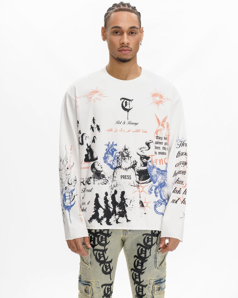 Person wearing a white long-sleeve shirt with graphic designs and text, standing against a white background.