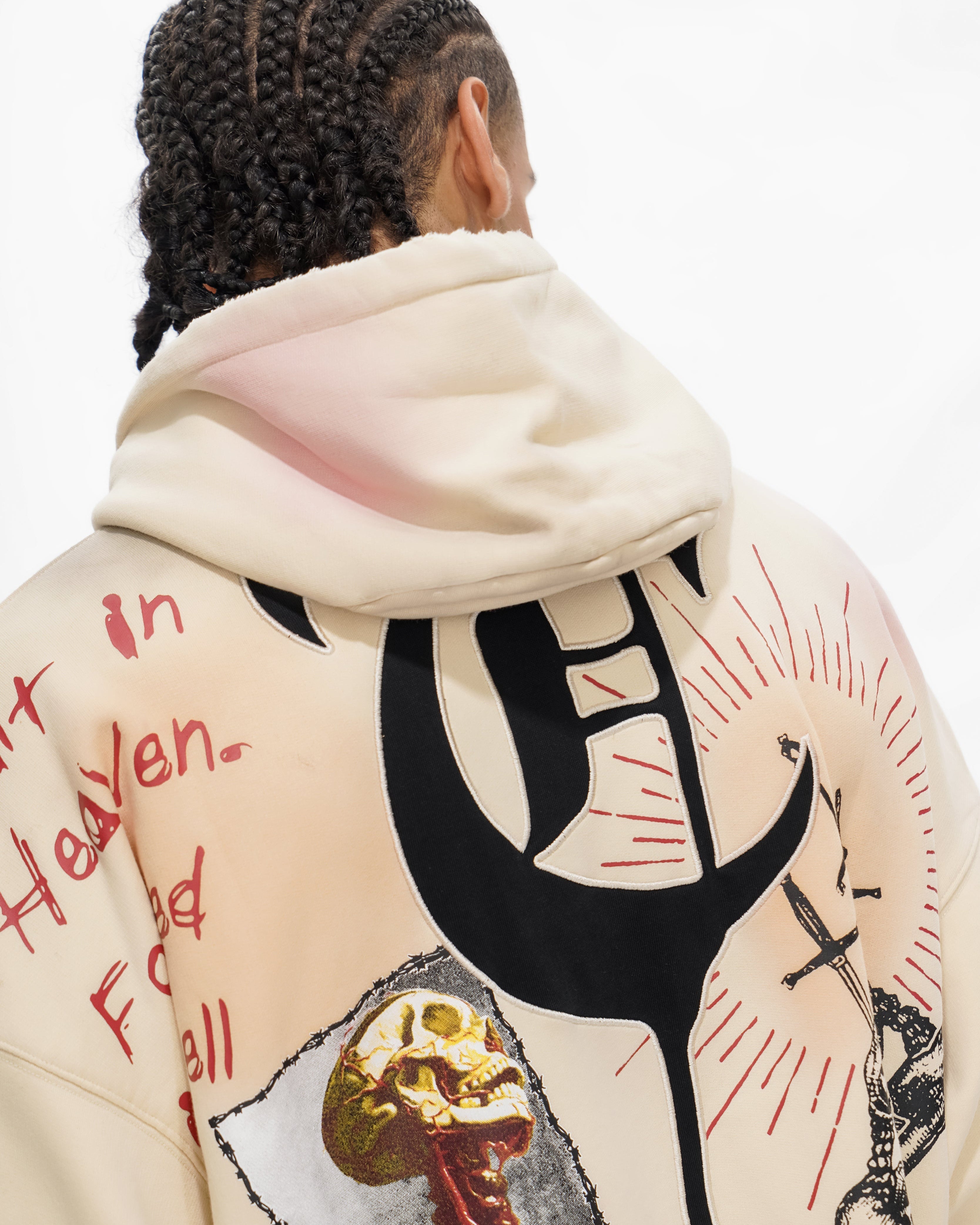 Beige hoodie with graphic designs and text on a white background