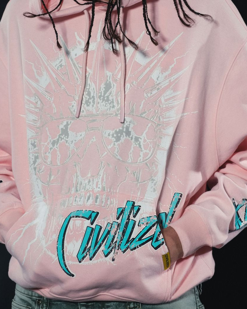 Pink hoodie with teal text and patterns on a black background