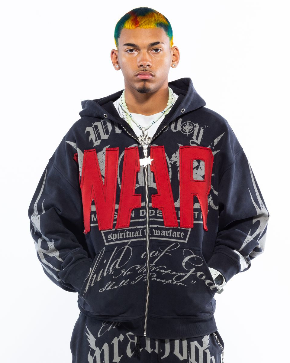 Person wearing a black hoodie with red text on a white background