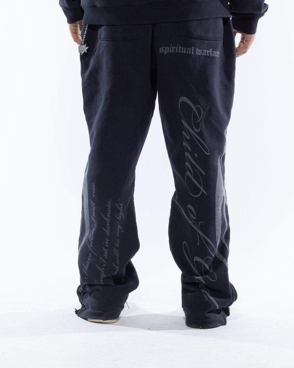 Black sweatpants with white text on a white background
