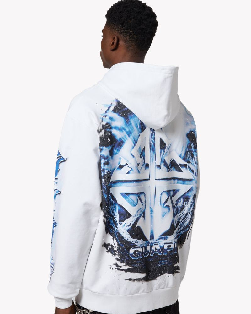 Person wearing a white hoodie with blue and black graphic design on the back