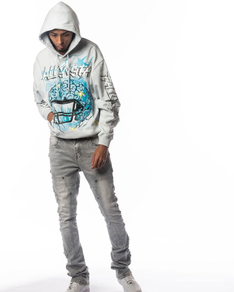 Person wearing a white hoodie with colorful graphics and text, standing against a white background