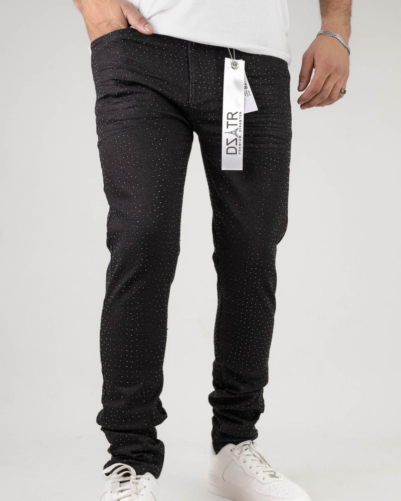 Person wearing black pants with a visible brand tag on a white background