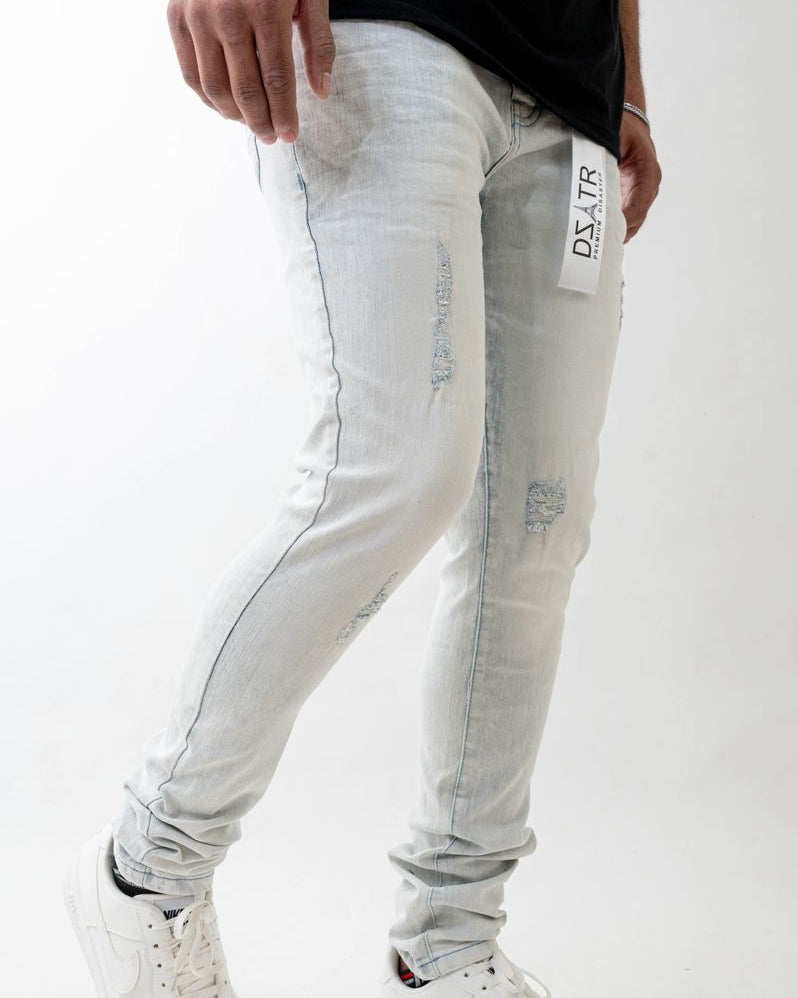 Light gray jeans with a brand tag on a white background