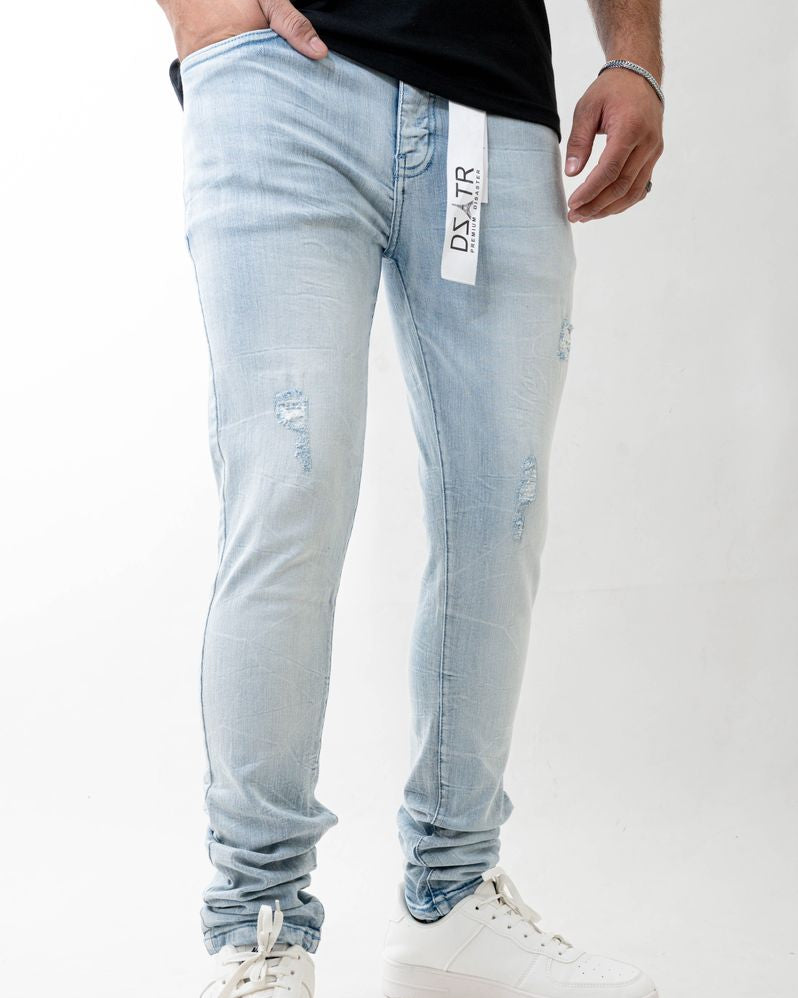 Light blue jeans with a brand label on a white background