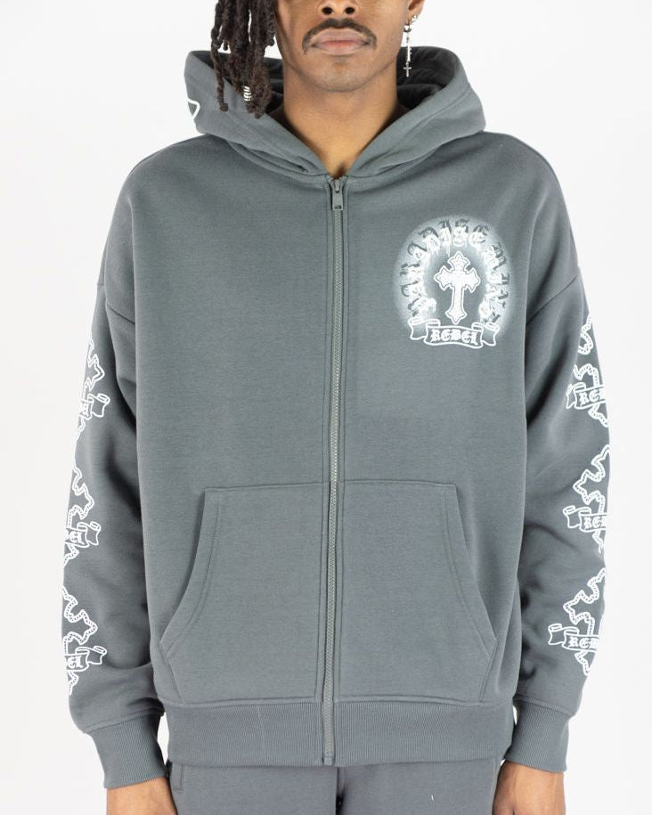 Person wearing a gray hoodie with white designs on a white background