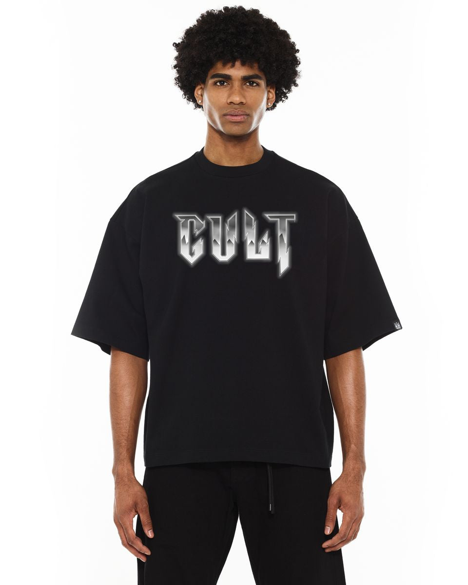 Person wearing a black t-shirt with 'CULT' text on a white background