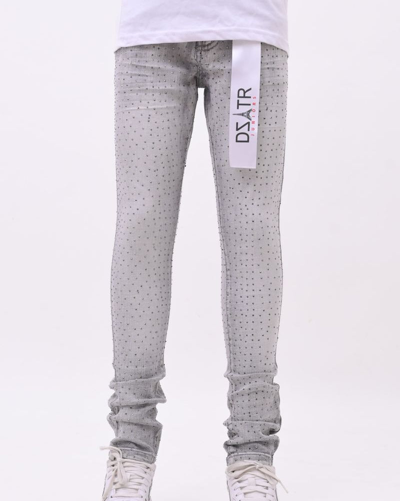 Gray patterned jeans with a visible brand label on a white background