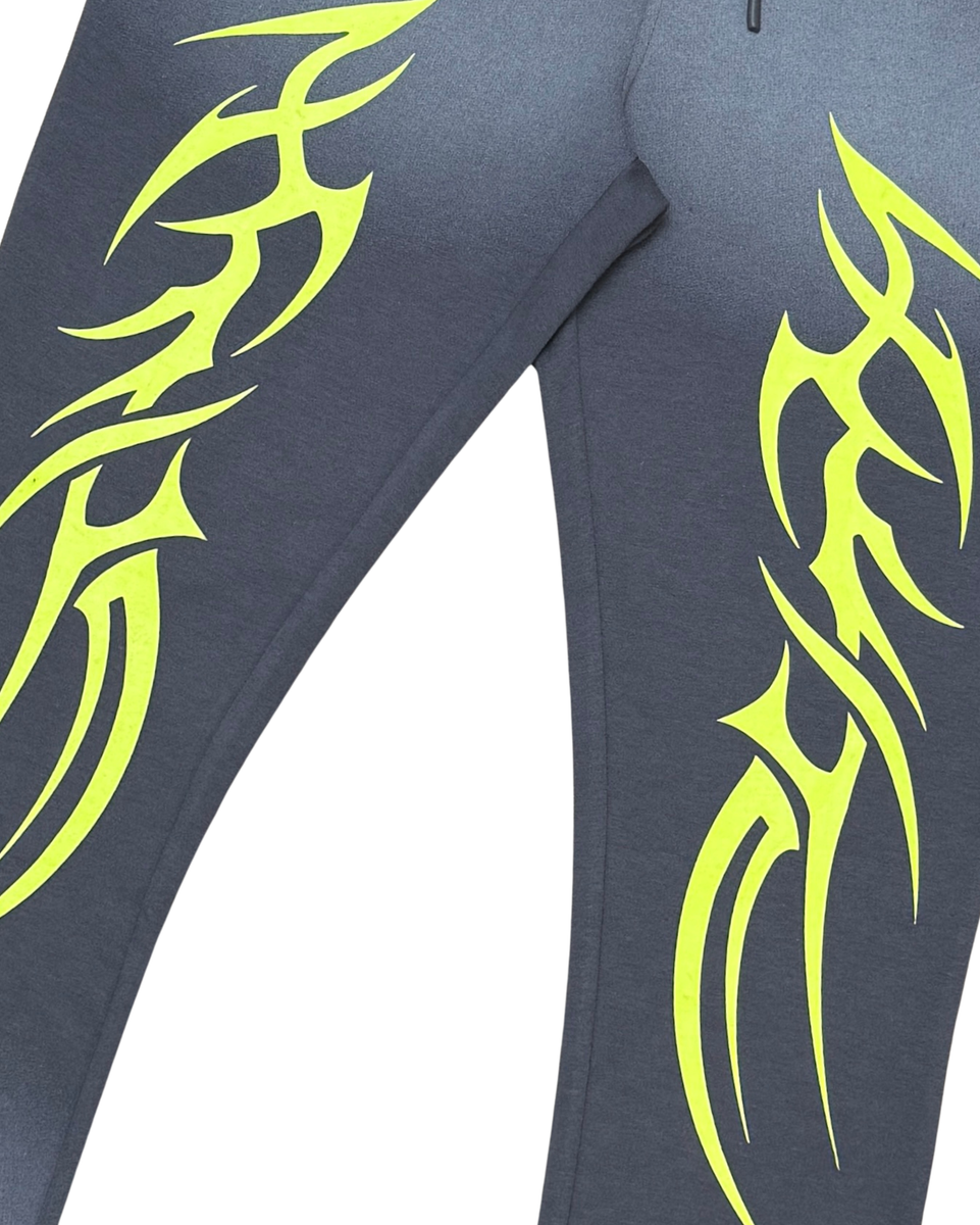 Gray leggings with green tribal designs on a white background