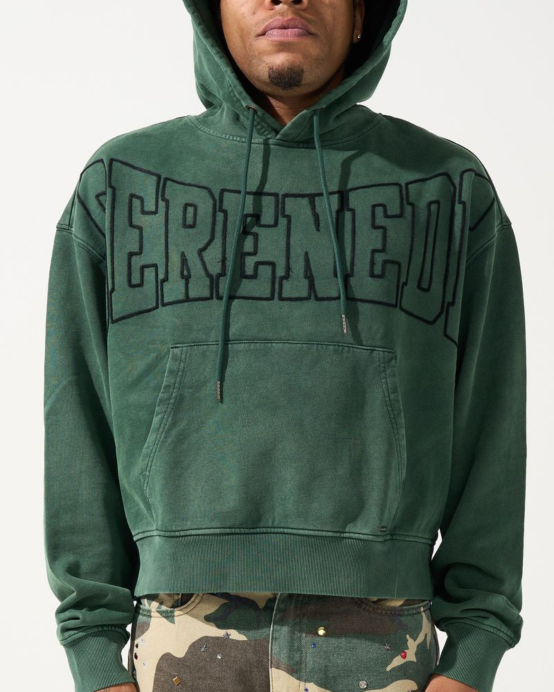 Person wearing a green hoodie with "SERENEDE' branding on a white background