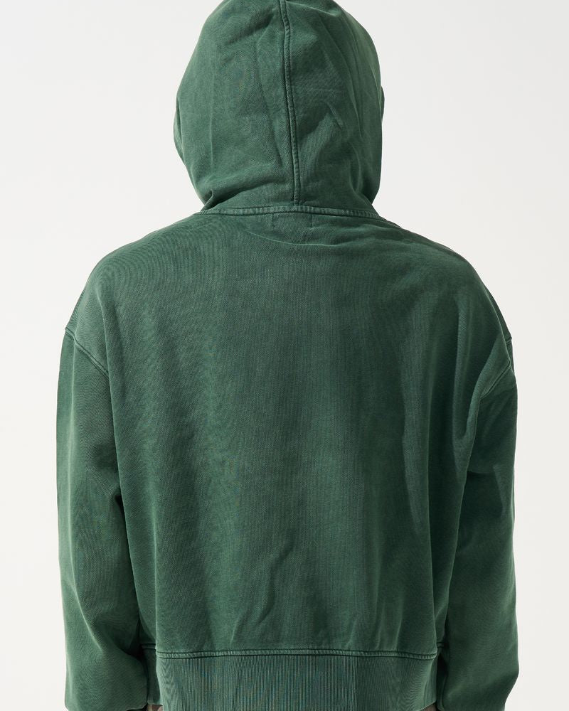 Green hoodie worn by a person on a white background