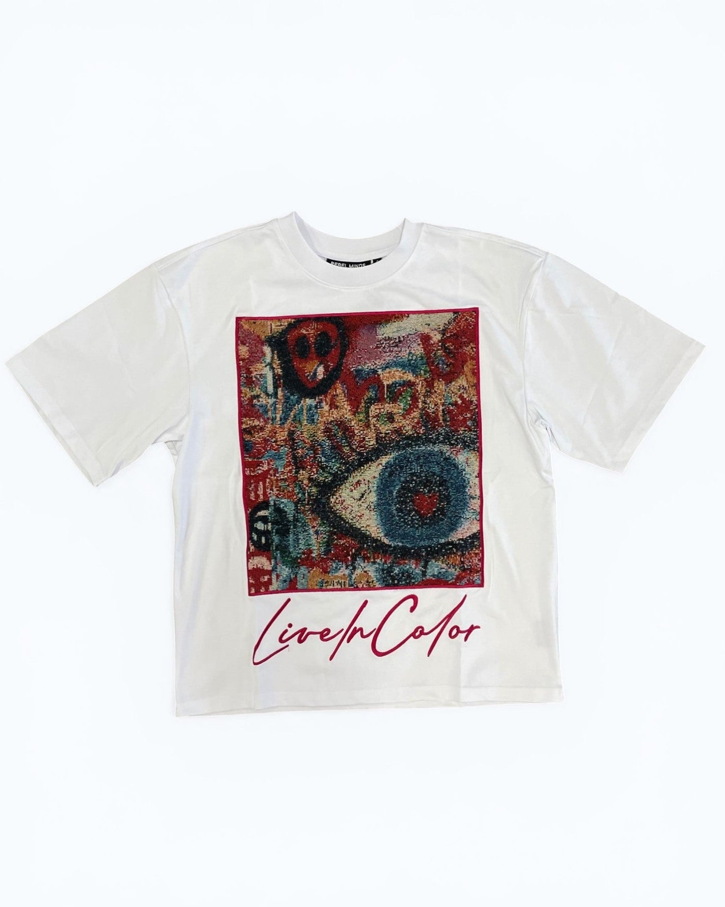 White t-shirt with colorful graphic design and 'Live in Color' text on a white background
