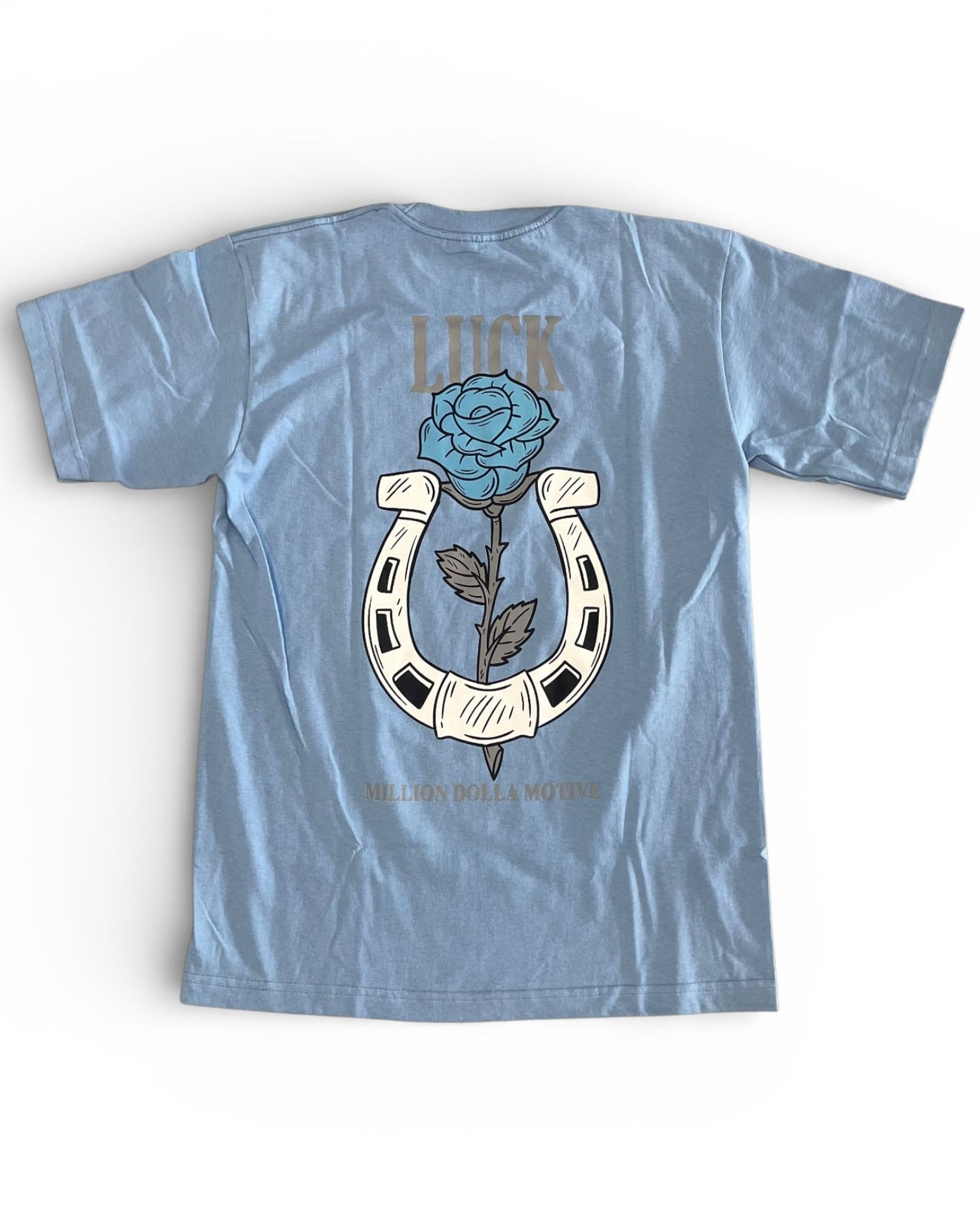 Light blue t-shirt with a graphic design on the back featuring a rose and horseshoe, with the word 'LUCK' above.