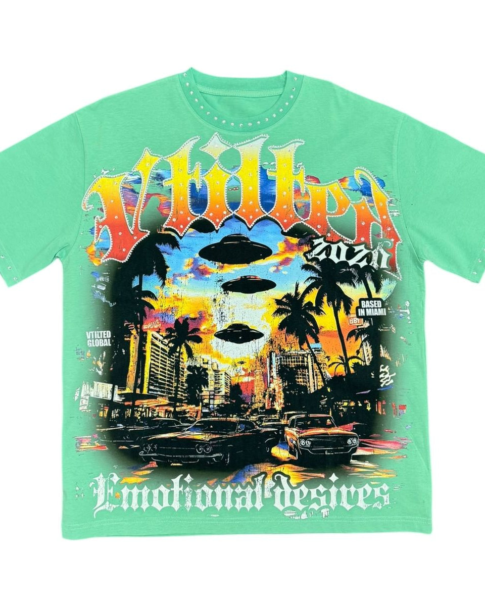 Green t-shirt with colorful graphic design on a white background