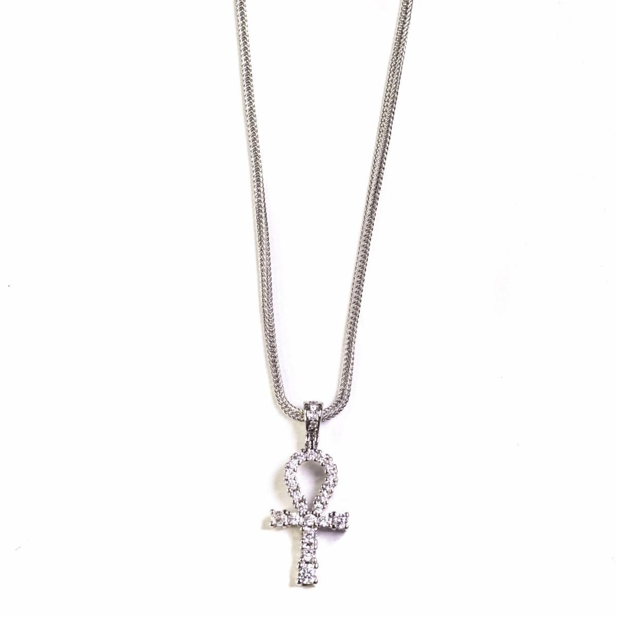Silver necklace with an ankh pendant on a white background