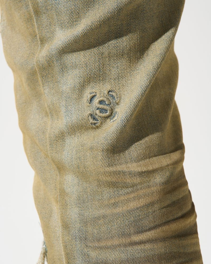 Close-up of a beige fabric with a logo on a white background