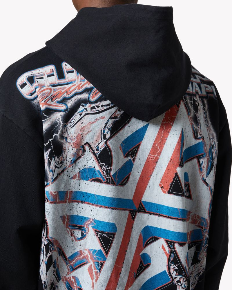 Person wearing a black hoodie with a colorful geometric pattern on the back