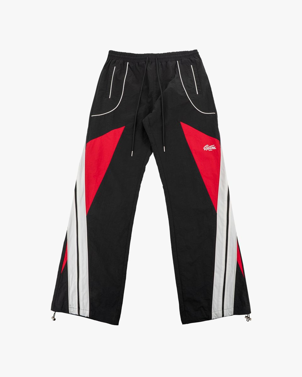 Black pants with red and white accents on a white background