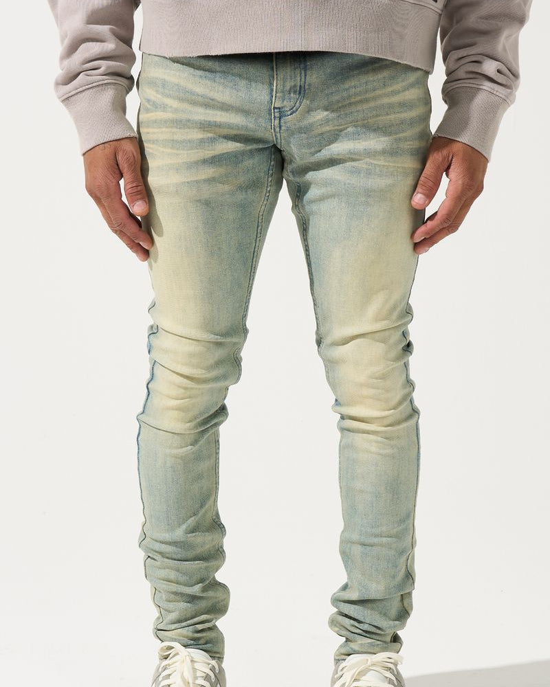 Light blue jeans worn by a person on a white background