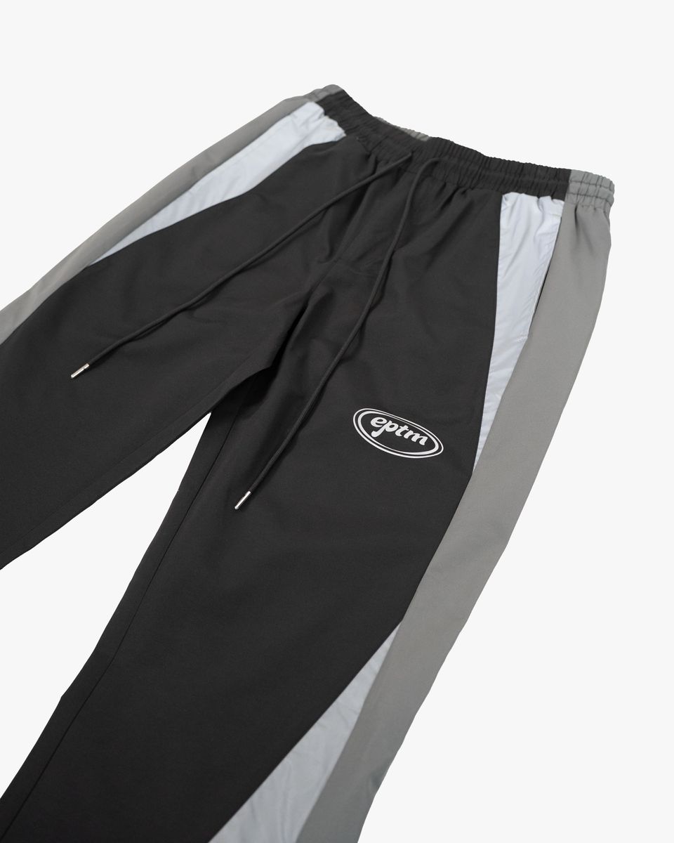 Black and gray pants with a logo on a white background
